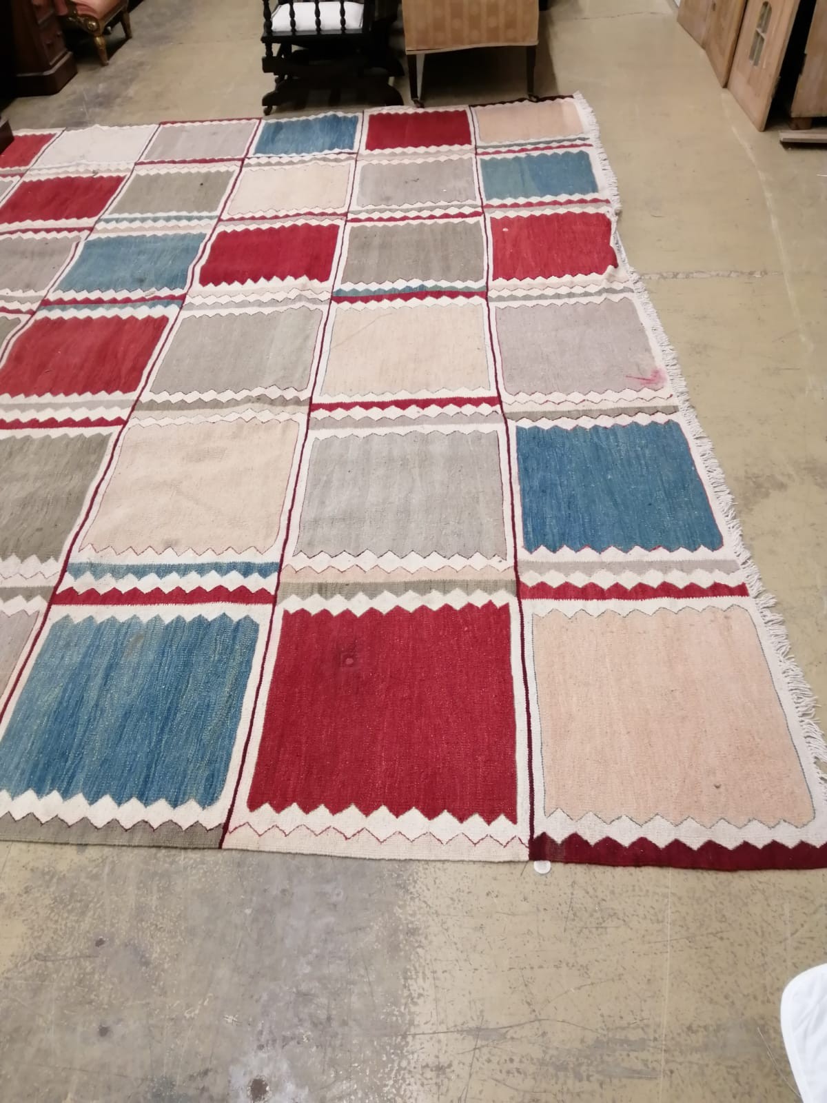 A large Kilim polychrome flatweave carpet of patchwork design, 460 x 370cm